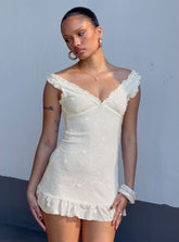 Minivestido blanco "Feeling Alive" con lazo en la espalda